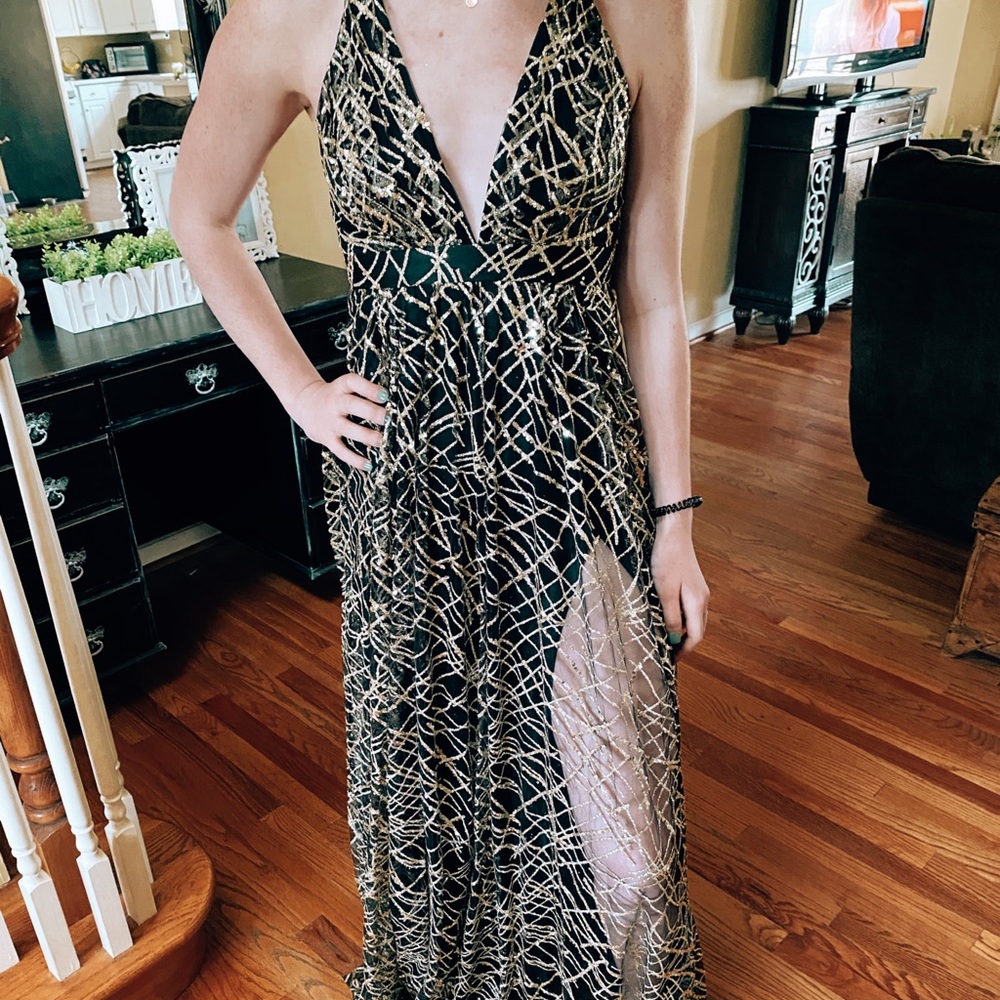 Luxxel dress new with tags. Black and gold